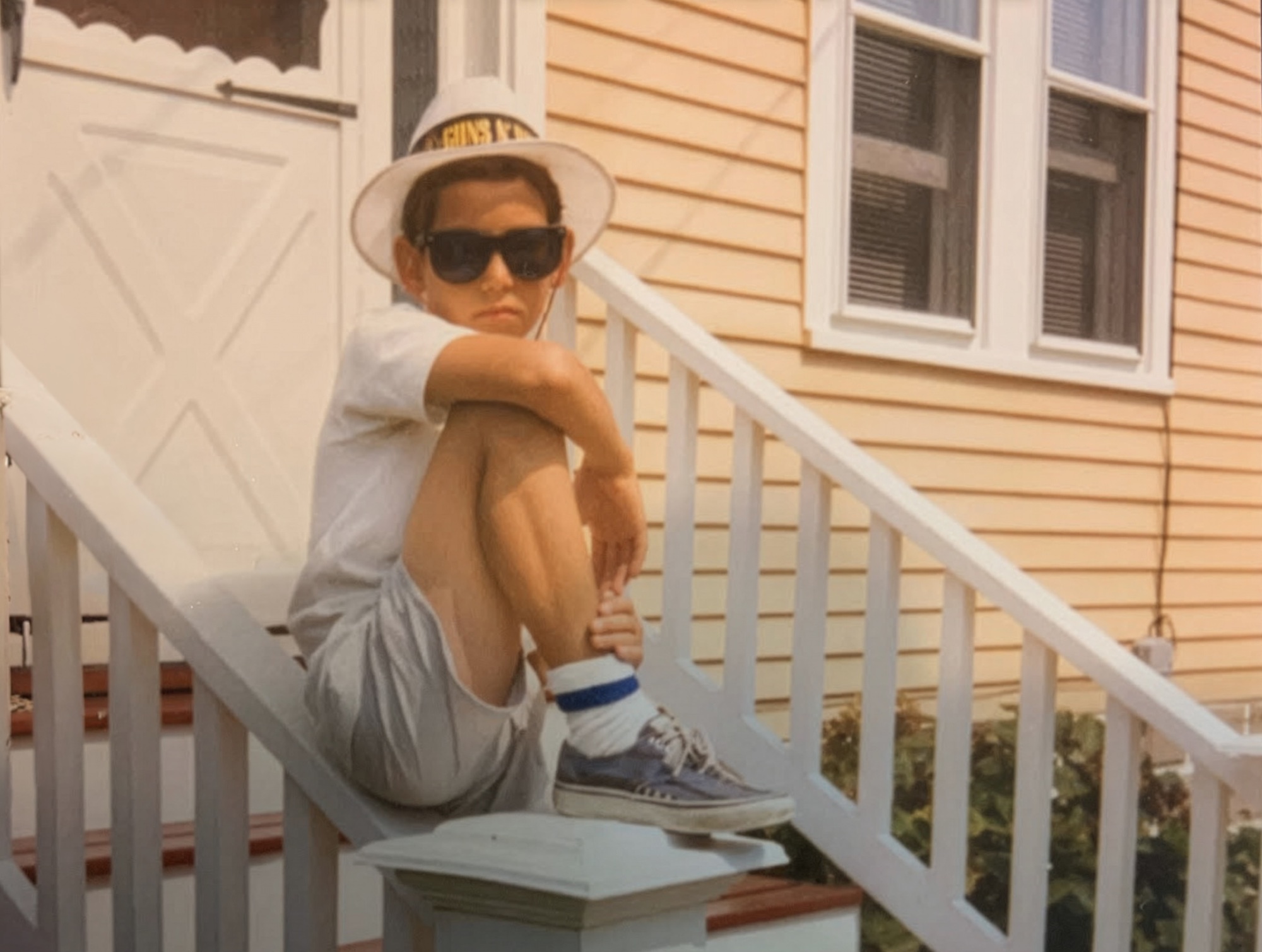Young Craig Whitaker on porch steps, Wildwood 1987
